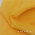 Tissu populaire de chemises en peau de pêche lavable teint uni